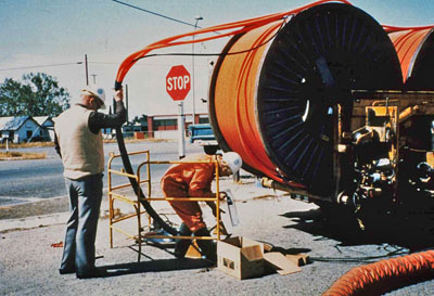 Underground fiber optic cable installation - pulling cable into duct